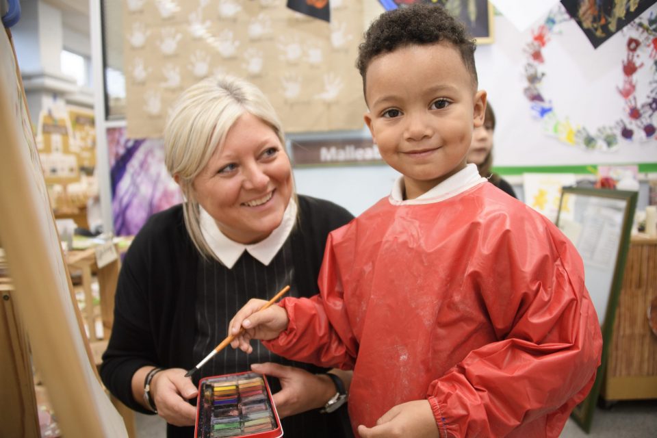 Boy and teacher watercolour painting